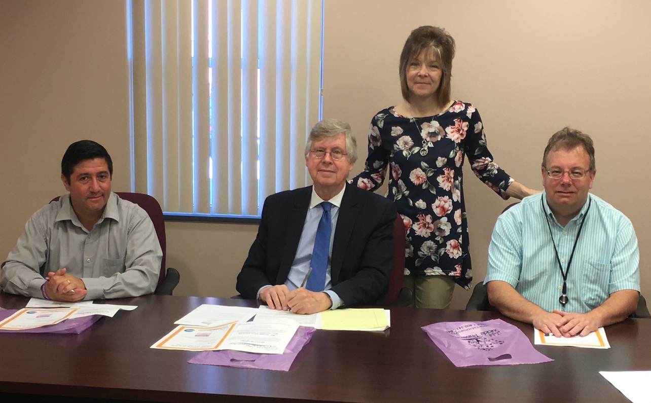 Pictured, in front from left, are Commissioners Tony Scotto, John A. Sobel, chair, and Mark B. McCracken. In the back is Mary Brown, Clearfield-Jefferson Suicide Prevention Team coordinator. (Photo by GANT News Editor Jessica Shirey)