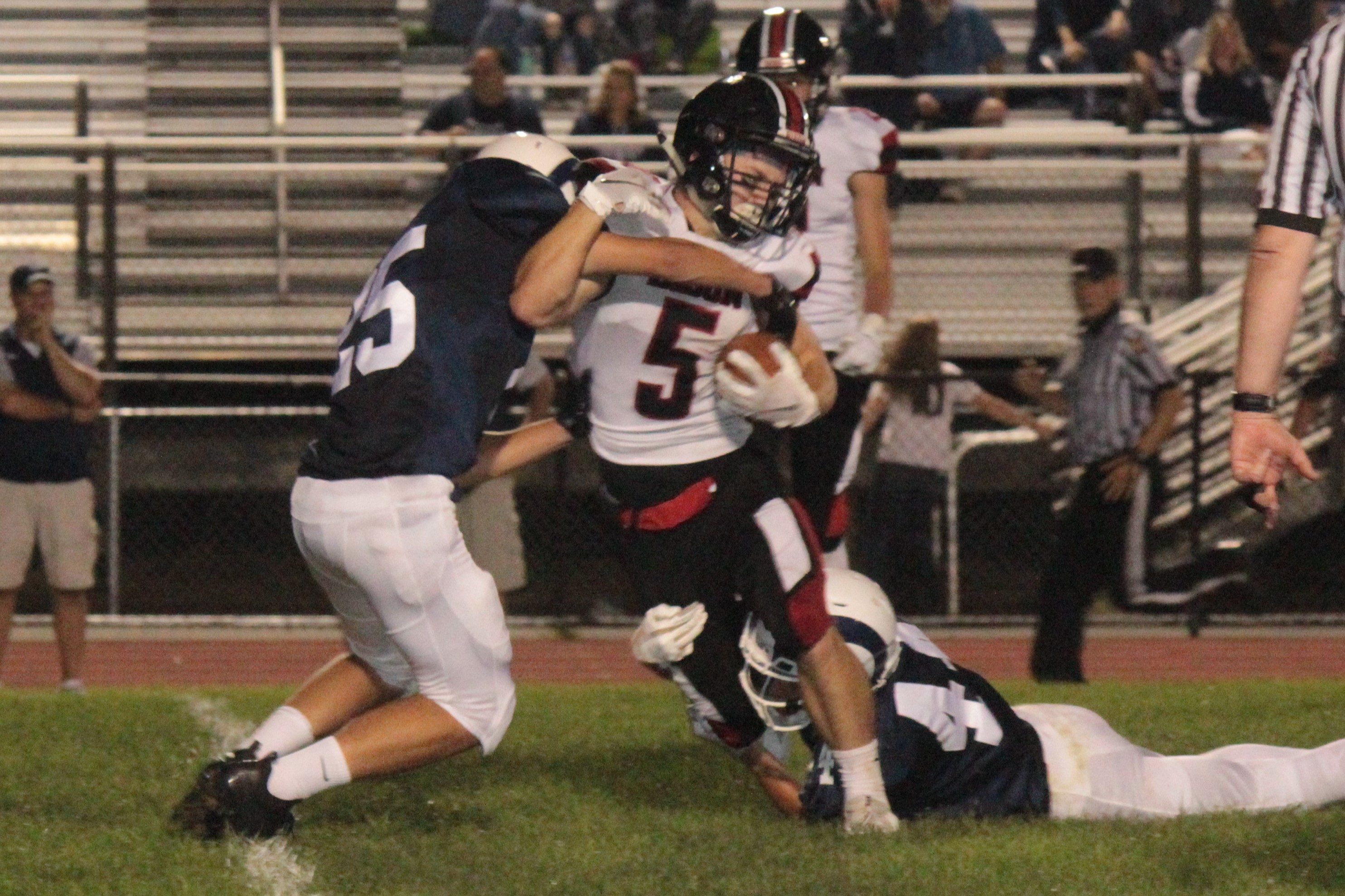 Although struggling for yards here, Caleb Freeland (5) had a career night, scoring five touchdowns.