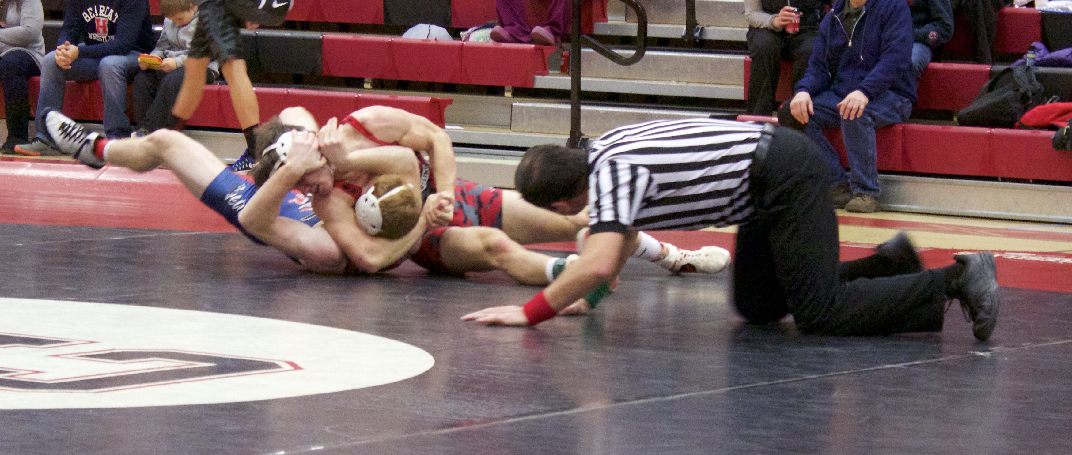 Freshman Luke McGonigal nearly pinned his opponent on Tuesday night. (Photo by HL)