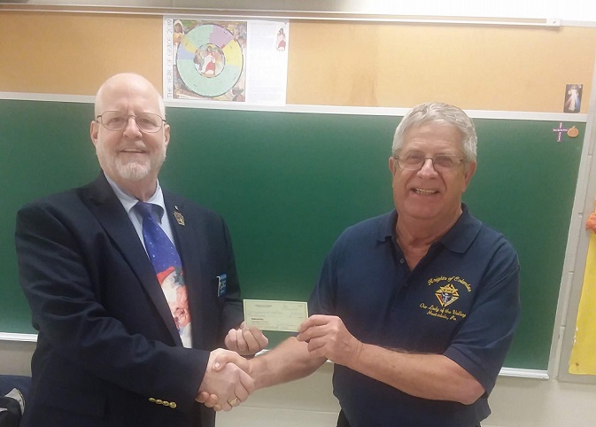 Pictured are District No. 81 Deputy Ed Master III and Council No. 10376 Grand Knight Jack Archer. (Provided photo)