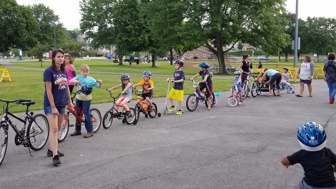 At a Safe Kids Clearfield County Bicycle Rodeo held last June at the DuBois City Park, local participants line-up for a parade to exhibit their new bike handling skills.  (Provided photo)