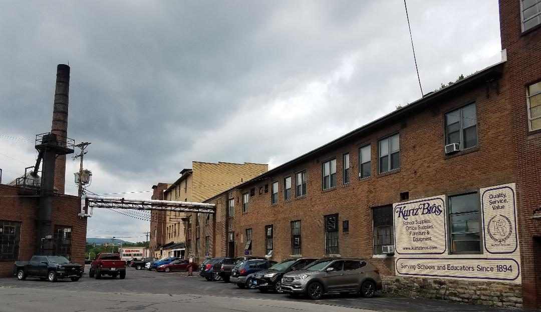Kurtz Bros. present-day facility on Reed Street in Clearfield, including its iconic smoke stack. The company has survived and thrived since first opening its doors in 1894. While the smoke plume rising from the stack has been part of the company for decades, the company will soon convert to natural gas. The smoke may be gone, but the stack will remain. Photo by Kimberly Finnigan)