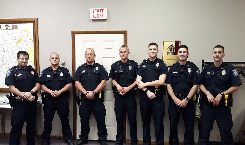 Police Chief Vincent McGinnis introduced the new full-time officer Ethan Fritz to the council Thursday night, and also some of the other new members of the police force.  From left are Assistant Police Chief Nathan Curry; McGinnis; Sgt. Daniel Podliski; Fritz; and part-time officers, Tyler Brahosley, Bryce Green and Austin Miller. (Photo by Wendy Brion)