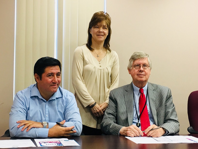 Pictured, in back, is Mary Brown, BH program specialist with Community Connections, with Commissioners Tony Scotto and John A. Sobel (front). (Photo by GANT News Editor Jessica Shirey)