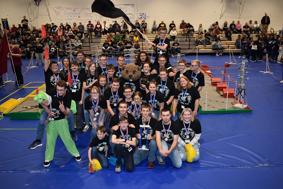 DuBois Area High School students raise their flag in celebration after winning first place in the Penn State DuBois BEST Robotics Competition on Saturday. (Provided photo)