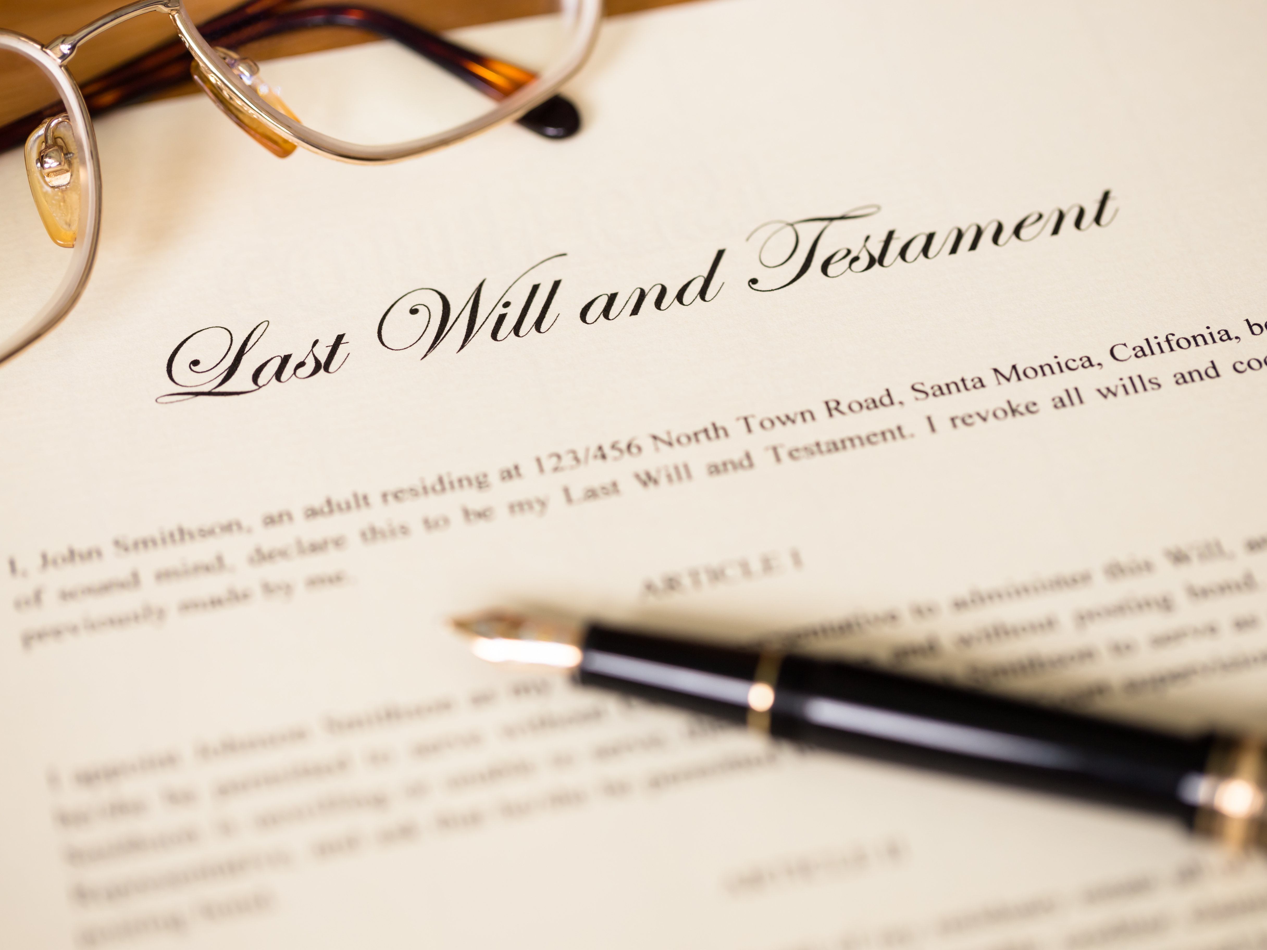 Last will and testament with pen and glasses concept for legal document