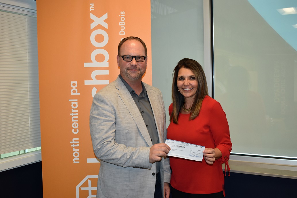 North Central PA LaunchBox Director Brad Lashinsky receives a $15,000 donation presented by First Commonwealth Bank-Trust Assistant Vice President and Trust Officer Lisa LaBue on behalf of the Glenn and Ruth Mengle Foundation. (Provided photo)