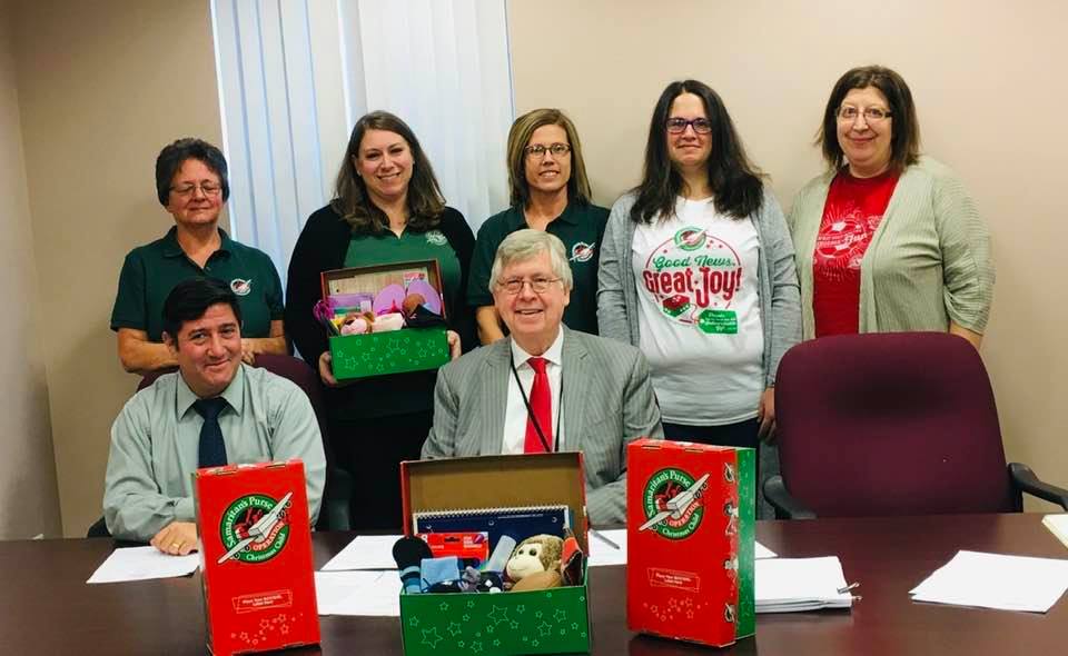 On Tuesday, the Clearfield County Commissioners proclaimed Nov. 18-25 as National Collection Week for Operation Christmas Child in Clearfield County. 
Pictured, in front, are Commissioners Tony Scotto and John A. Sobel, chairman. Missing from photo is Commissioner Mark B. McCracken. 
In the back, are: Karen Addleman, church relations volunteer; Karla Sunderlin, OCC West-Central PA area coordinator; Arianne Greslick, First Baptist Church, Curwensville, drop-off leader; Donna Daub, community relations volunteer; and Jessica Shirey, media relations volunteer. 
(Provided photo)