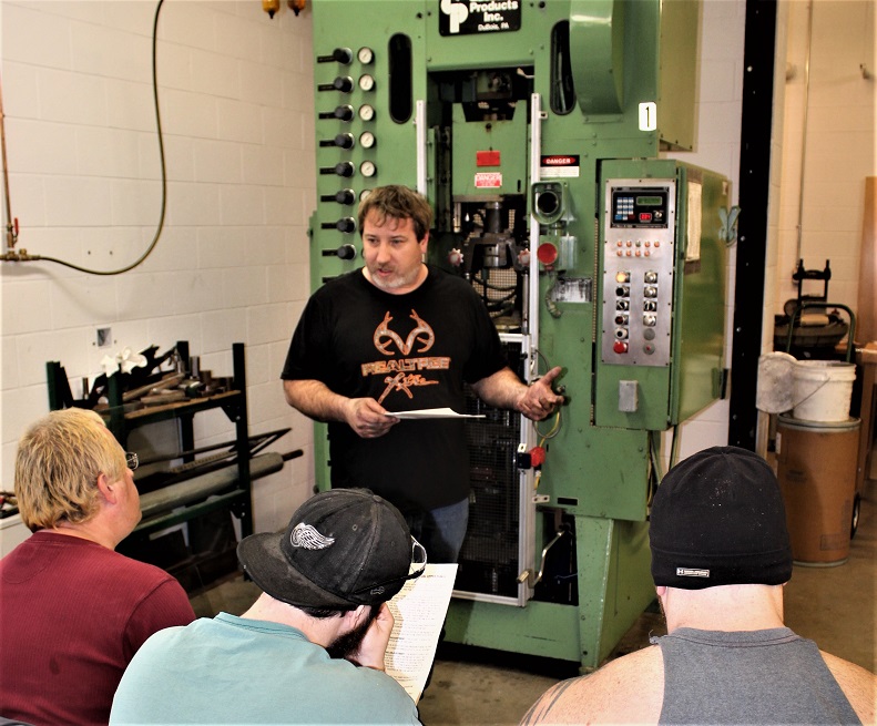 Chris Freemer, instructor for introduction to Die Setting, provides hands-on instruction in the Penn State DuBois engineering labs. (Provided photo)
