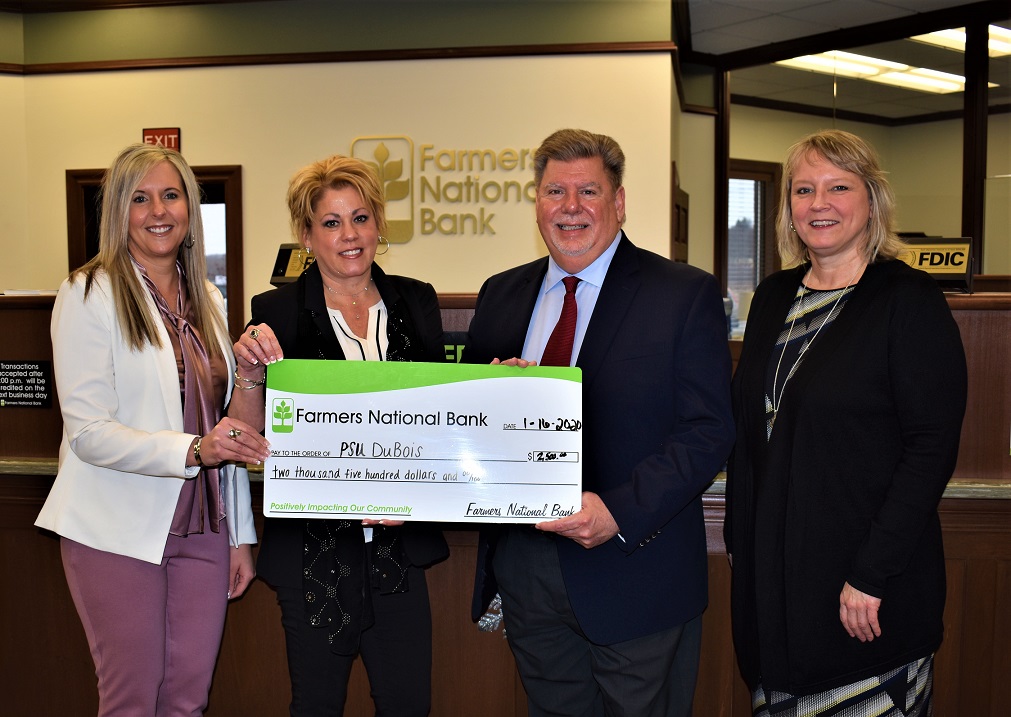 Pictured, from left, are: Farmers National Bank Vice President of Business Banking Danyell Bundy and DuBois Branch Manager Kelli Allison, who present a $2,500 check to Penn State DuBois Chancellor M. Scott McBride and Director of Development Jean Wolf. (Provided photo)