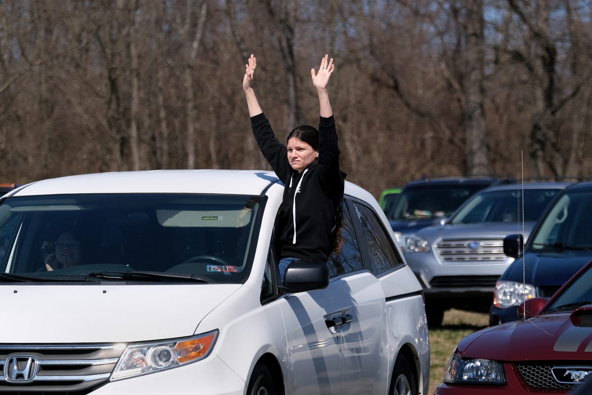 A parishioner raises their hands as they sit in their cars during Bethany Wesleyan Church’s Sunday worship service Mar. 22, 2020, at Becky’s Drive-In in Walnutport, Pennsylvania. Concerns over the coronavirus have closed churches in an effort to avoid gatherings of large crowds.

Matt Smith / Keystone Crossroads