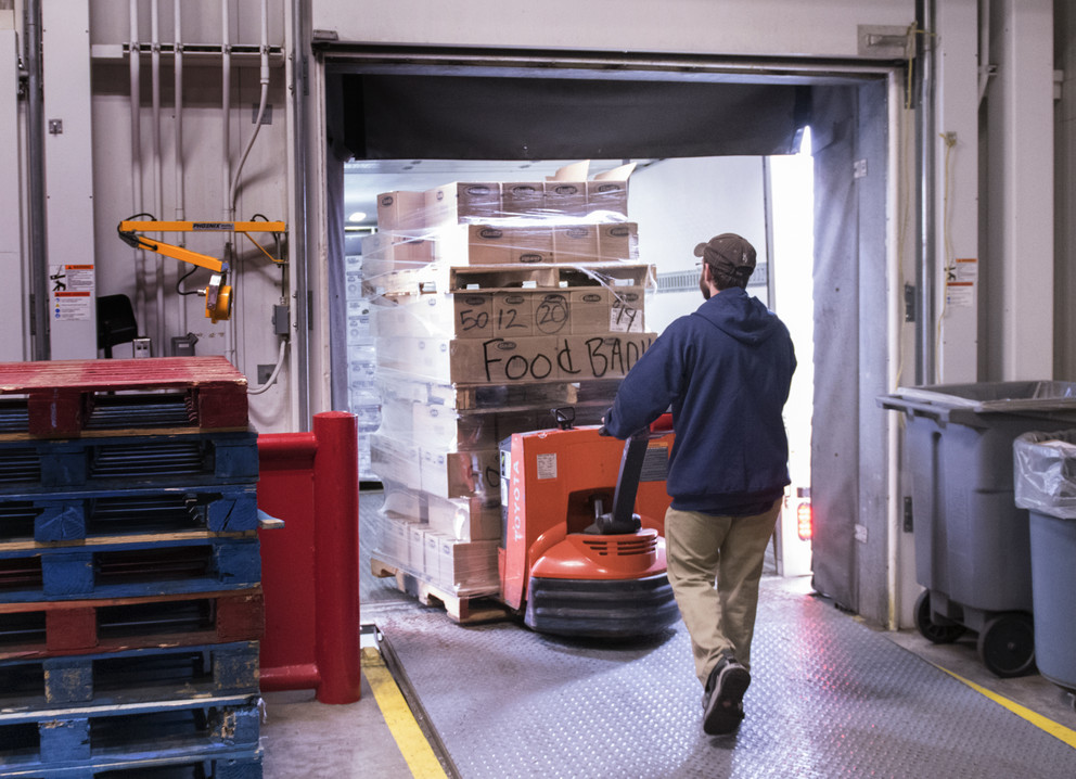 Robert Whistler, an employee at Penn State Housing and Food Services, loads a pallet of donated food into a Central Pennsylvania Food Bank truck on the afternoon of March 19.Image: Patrick Mansell