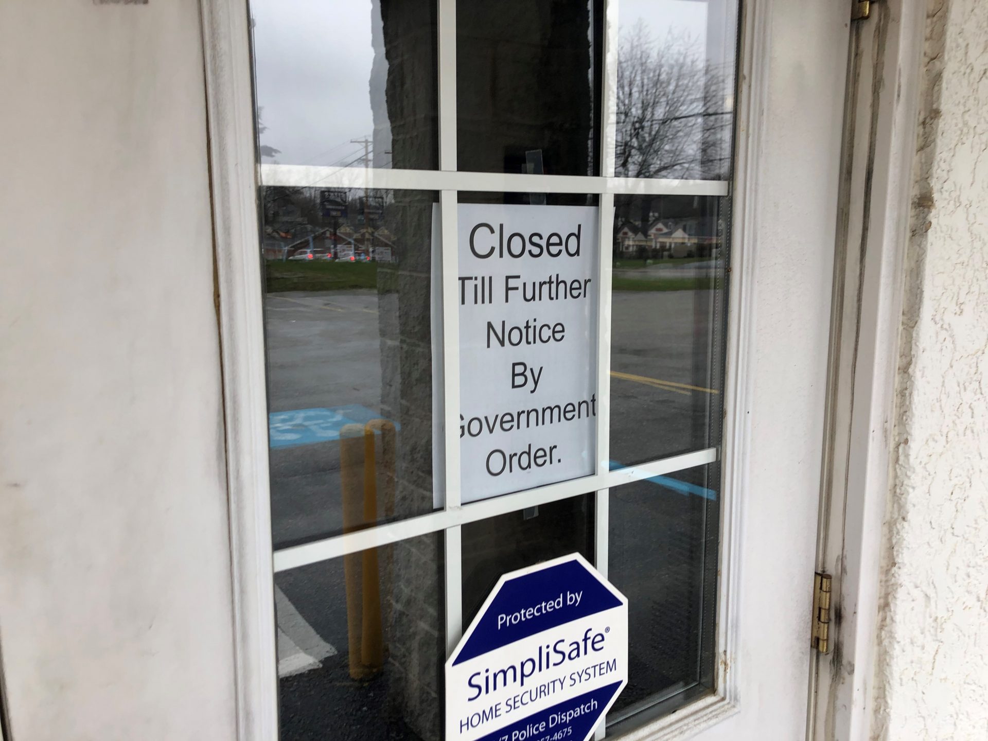 A sign at a barbershop in southern York County references Gov. Tom Wolf’s March 19 order to close “non-life sustaining” businesses. (Ed Mahon / PA Post)