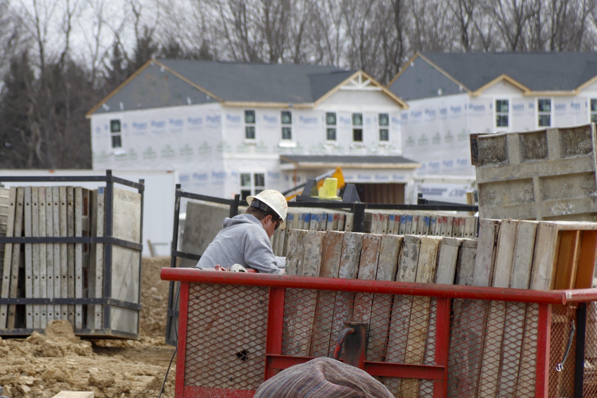 Construction continues at a housing plan in Zelienople, Pa., Wednesday, March 18, 2020. Economic and housing market trends at the start of the year both favored U.S. homebuilders' prospects for 2020. That was then. But with the coronavirus outbreak now expected to tip the U.S. into recession, the National Association of Home Builders projects that new home construction and sales will take a hit as efforts to contain its spread disrupt large swaths of the economy.

Keith Srakocic / AP Photo