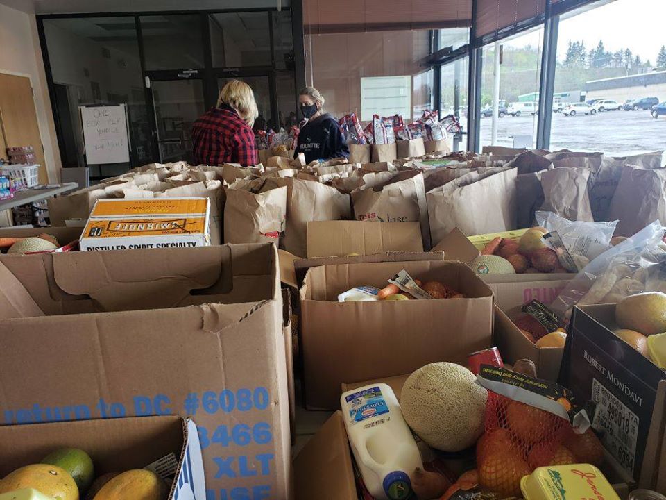 Boxes filled with fresh vegetables, eggs, milk and other groceries wait to be handed out to anyone who asks for them at one of the Mo Valley YMCA’s Anti-Hunger Family Centers. (Photo courtesy of the Mo Valley YMCA)