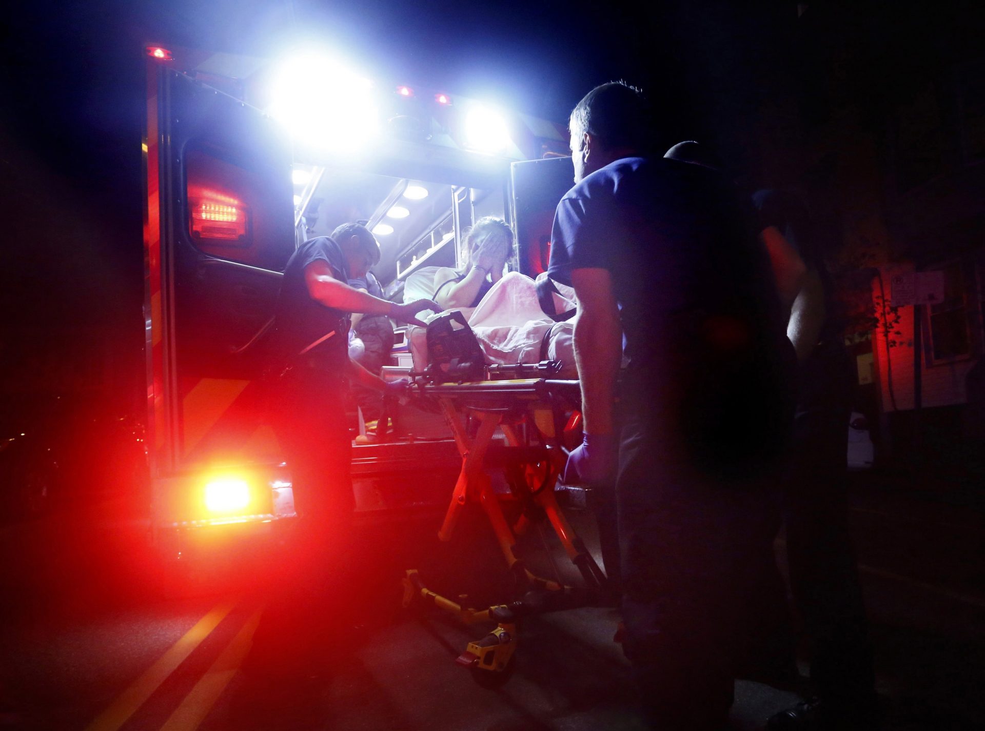 Paramedics in Portland, Maine, respond to a call for a heroin overdose. A new report estimates some $60 billion was spent on health care related to opioid addiction in 2018.

 Derek Davis / Portland Press Herald/Getty Images