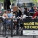 People gather at tables outside Bar Louie on the Northside of Pittsburgh Sunday, June 28, 2020. In response to the recent spike in COVID-19 cases in Allegheny County, health officials are ordering all bars and restaurants in the county to stop the sale of alcohol for on-site consumption beginning on June 30. (Gene J. Puskar / AP Photo)