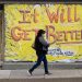 A person wearing a protective face mask as a precaution against the coronavirus walks by a closed storefront in Lebanon, Pa., Tuesday, May 12, 2020.  Matt Rourke / AP Photo