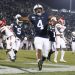 Penn State running back Journey Brown (4) celebrates his third quarter touchdown run against Rutgers during an NCAA college football game in State College, Pa., on Saturday, Nov. 30, 2019. Penn State defeated Rutgers 27-6. (AP Photo/Barry Reeger)