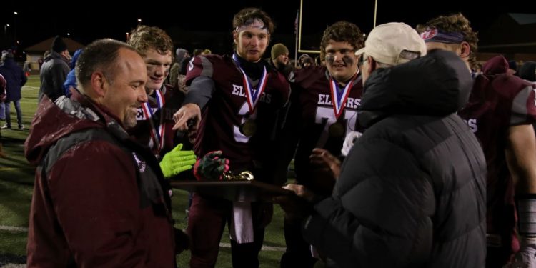 Ridgway head coach Mark Heindl (left) receives the D9 Class 2A championship plaque from D9 tournament chairman Bob Tonkin after winning last year's title. D9 released its playoff plan Wednesday.