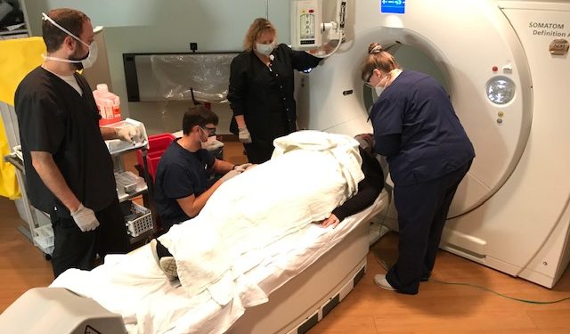 Employees at Penn Highlands Elk recently participated in a stroke response refresher training. Pictured are PH Elk Emergency Department nurses Hope Klaiber, RN, and Nick Burdick, RN, along with radiologic technologists Dan Eagen and Jen Gnan. Acting as the patient is Ashlee Stefano, imaging secretary. (Provided photo).