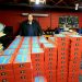 Matt Reed of First Class Children’s Foundation poses in his garage with over 300 “Imagination Boxes” full of school supplies and books for students that the group distributed at the C. G. Johnson Elementary School in Reynoldsville last month.