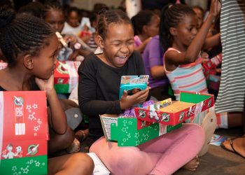 Sheer joy overwhelms a girl in the African nation of Namibia as she opens her gift-filled shoebox. (Photo courtesy of Samaritan’s Purse)