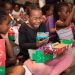 Sheer joy overwhelms a girl in the African nation of Namibia as she opens her gift-filled shoebox. (Photo courtesy of Samaritan’s Purse)