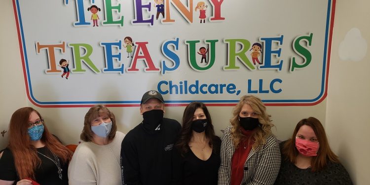 Pictured, from left to right, are:  Elizabeth Stubbs, childcare worker; Joyce Stubbs, assistant director; Dennis and Dana McCahan, owners; Jean Maines, director; and Rachel Grisby, kitchen/childcare worker. Main Street Manager Loretta Wagner (CRC) was present but not in photo. (Provided photo)