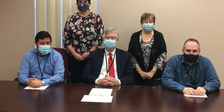 Pictured, in front, are: Clearfield County Commissioners Tony Scotto, John A. Sobel, board chairman, and Dave Glass. In the back are: Julie Fenton, director of education and community service, and Joan Bracco, marketing coordinator and ombudsman, for the Clearfield County Area Agency on Aging (CCAAA). (Photo by GANT News Editor Jessica Shirey)