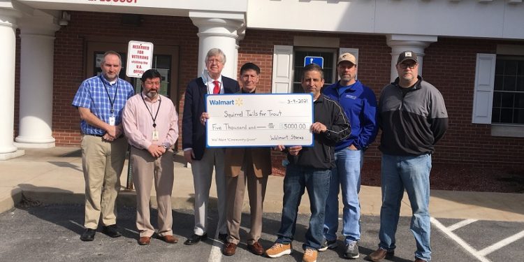 Pictured, from left to right, are: Commissioners Dave Glass, Tony Scotto, John Sobel, board chairman; Pat Domico, Squirrel Tails for Trout coordinator; and Tim Opaliski, Rich Jenny and Rich Terry, all of Walmart Distribution Center, Woodland. (Photo by GANT News Editor Jessica Shirey)