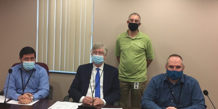 Pictured, in front, are: Commissioners Tony Scotto, John Sobel and Dave Glass. In the back is Jeremy Ruffner, 911 coordinator. (Photo by GANT News Editor Jessica Shirey)