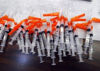 Syringes containing vaccine stand at the ready for members of the public to get the vaccine administered to them in the Sullivan County Elementary School in Laporte Bourgh Sullivan County Pennsylvania     Fred Adams/for Spotlight PA  1-29-21

Fred Adams / For Spotlight PA
