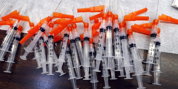 Syringes containing vaccine stand at the ready for members of the public to get the vaccine administered to them in the Sullivan County Elementary School in Laporte Bourgh Sullivan County Pennsylvania     Fred Adams/for Spotlight PA  1-29-21

Fred Adams / For Spotlight PA