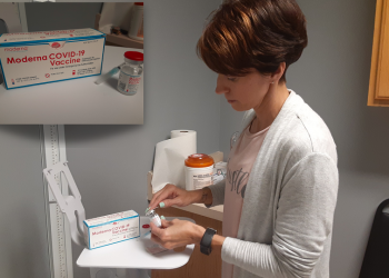 Practice Manager Megan Patrick, RN, RD, NHA, prepares to administer an initial dose of the Moderna COVID-19 vaccine. (Provided photo)