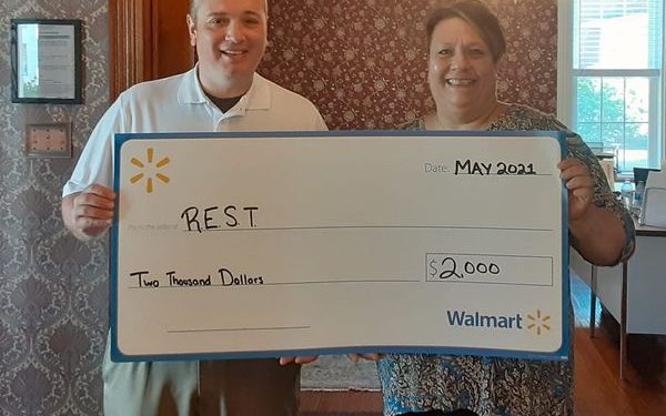 Josh Kunkle, Clearfield Walmart store manager (left) awards REST Inc. Founder Bobbie Johnson (right), a Local Community Grant in support of the REST Comfort Box program. (Provided photo)