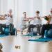 Group of senior people exercising on balls together in a gym