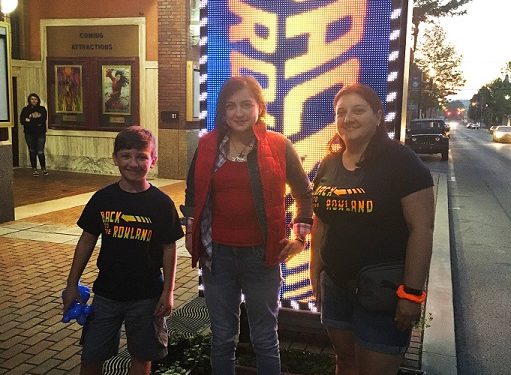 The Rowland Theatre in Philipsburg had many clever ideas to support their showings of older films during the pandemic. They opened in June 2020 with Back to the Rowland as their theme as they presented the classic Back to the Future. Getting into the spirit of the film, Kelley Wilks of Philipsburg, center, dressed as Marty McFly and Johnny Levonick, at left, and his mother Ambra Levonick, at right, wore Back to the Rowland t-shirts.  (Photo courtesy of the Rowland Theatre)