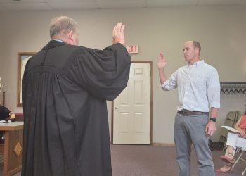 Brian Lytle is sworn in by Magisterial District Judge Michael Morris into the Clearfield Borough Council.  This is his second stint with the Council.