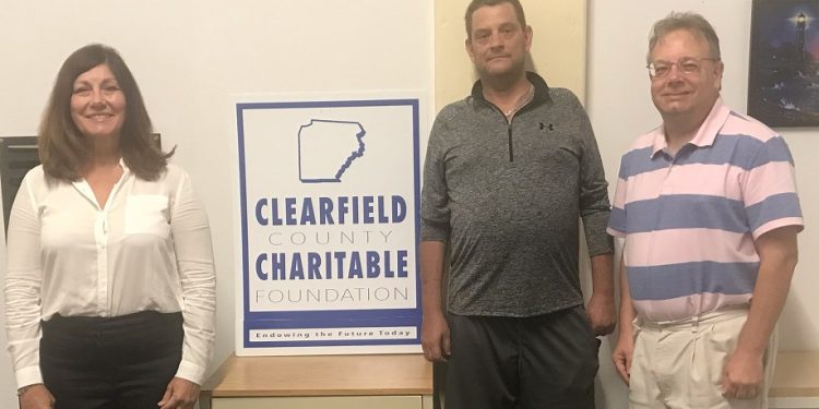 Pictured, from left to right, are: Marjann Young, Bob Perks Fund development coordinator, Bob Berg, recipient of Bob Perks Fund assistance, and Mark B. McCracken, executive director of the Clearfield County Charitable Foundation.