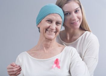 Young daughter and her mother with breast cancer staying together