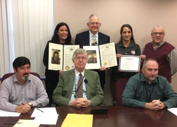Pictured, in front from left, are: Commissioners Tony Scotto, John A. Sobel, board chairman, and David Glass. In the back, from left, are: Andrea Schickling, from the Clearfield office of State Sen. Wayne Langerholc Jr., Don Schmidt, Champion of the PA Wilds Award recipient, LaKeshia Knarr, entrepreneurial ecosystem director, PA Wilds Center for Entrepreneurship Inc., and Nick Hoffman, PA Wilds Center board member. (Photo by Jessica Shirey, GANT News Editor)