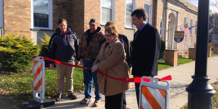 Clearfield Borough Operations Manager Leslie Stott cut the ribbon Monday to celebrate the completion of the Front Street Betterment Project in Clearfield Borough. (Photo by GANT News Editor Jessica Shirey)