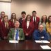 In front, from left, are Commissioners Tony Scotto, John A. Sobel, board chairman, and Dave Glass. In the second row are: students Chloe Rowles, Karly Framer and Raven Myers. In the third row are: students Makenzie Hullihen, Lydia Swatsworth, Savanna Anderson, REST Inc. Board President Julie Fenton, student William Rainey, and REST Inc. Board Member Susie Albert with her granddaughter, Lauren Phillips. (Photo by GANT News Editor Jessica Shirey)