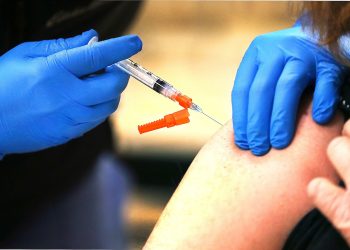 Officials around the world are united in their No. 1 recommendation: Get vaccinated if you aren’t already, and if you are, get a booster shot. Fred Adams / For Spotlight PA
