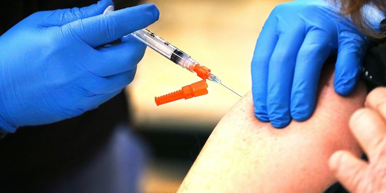 Officials around the world are united in their No. 1 recommendation: Get vaccinated if you aren’t already, and if you are, get a booster shot. Fred Adams / For Spotlight PA