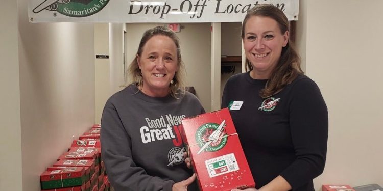 Pictured are Shelly Rhoades, West Central PA area coordinator, and Karla Sunderlin, Mid-Atlantic North regional area coordinator, with shoebox number 15,001 collected Nov. 21 during National Collection Week. The area collected 16,751 gifts in all, and exceeded its goal by 1,750 shoeboxes (Provided photo)