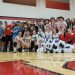 The Lady Bison posed with the student section after the victory over Curwensville.