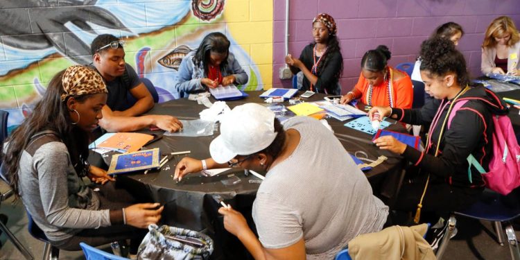 Students from Mastery Charter School-Pickett Campus in Philadelphia decorate their graduation caps June 13, 2018.

Mark Stehle / AP Photo