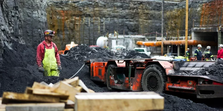 A worker waits for a piece of heavy machinery to pass by June 7, 2017, at a coal mine in Friedens, Pa.

Dake Kang / AP photo